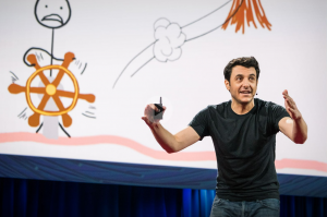 Animated slide and energetic speaker illustrating procrastination.